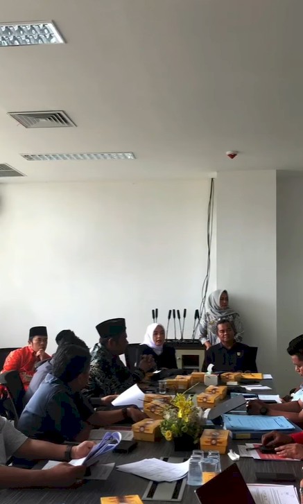 a penguin robot talking with a human